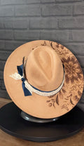 Prairie Lace - warm tan wide brim hat with engraved floral artwork, navy ribbon and cream lace